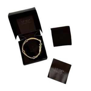 UNIQUE by Yanbal Gold Mixed Tone Spring Ring Bracelet NEW